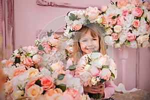 Girl with flowers. Baby with a flower bouquet for his birthday or for his mother `s day