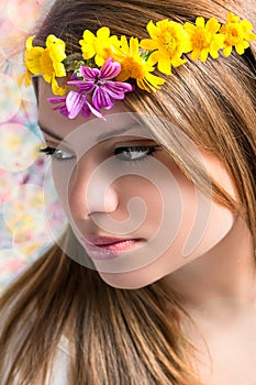 Girl with flowers on the head photo