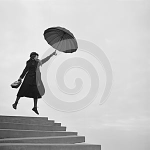 Girl flying away on umbrella