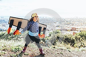 Girl flying disguised as a superhero with costume