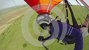 Girl flying on a hang-glider