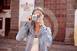 Girl focusing on taking a picture