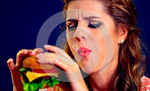 Girl in food places eats burger