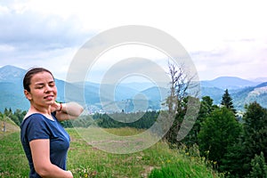 Girl in forest breathe fresh air. Mountain landscape