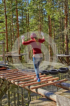 Girl in a Forest Rope Park Challenge