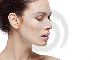 Girl with foundation cream on face