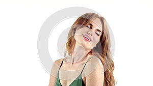 Girl in a freckle smiles a beautiful smile. White background. Slow motion