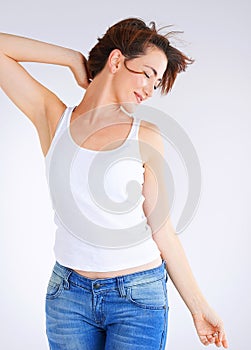 Girl, freedom and confident for fashion in studio with tank top, attitude and jeans for trendy style. Woman, organic