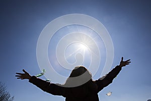 Girl freeing herself from the protective mask after overcoming illness, virus, covid-19. coronavirus