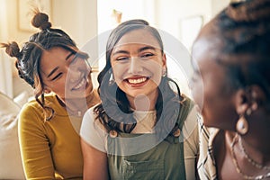 Girl friends, happy conversation and home with care, bonding or connection in living room on holiday. Gen z women