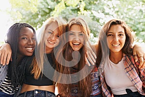 Girl friends, happy hug and portrait outdoor with diversity in group on holiday summer camp. Female student, sunshine