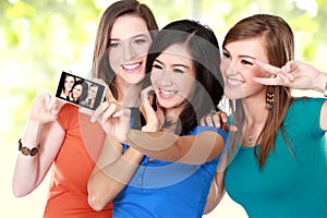 Girl friends taking a picture of themselves