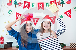 Girl frind holding christmas gift box and smile