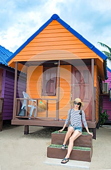 Girl in front of beach house