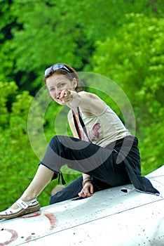 Girl on fuselage plane photo