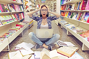 Girl with gadget at the bookshop