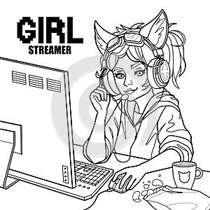 Girl gamer or streamer with cat ears headset sits at a computer.