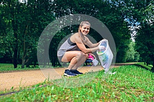 Girl with garbage bag doing plogging