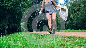 Girl with garbage bag doing plogging