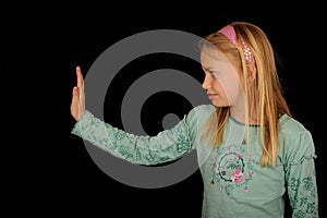 Girl gesturing halt sign