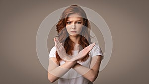 Girl Gesturing No Crossing Hands Posing Over Gray Background, Panorama