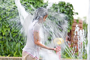 Girl getting drenched