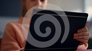 Girl getting education with modern gadget. Pupil studying with digital tablet