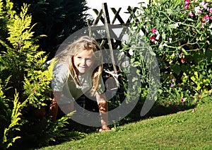 Girl getting out from bush