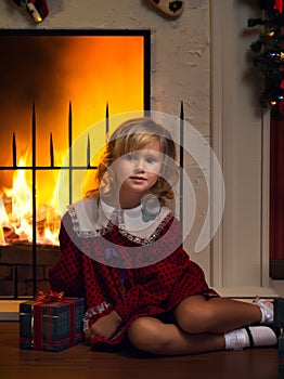 Girl with gift box in  christmas domestic environment