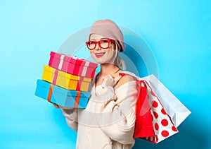 Girl with gift boxes and shopping bags