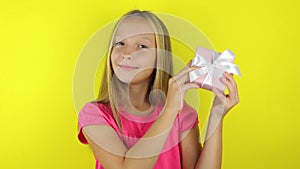 girl with a gift on a colored background close-up