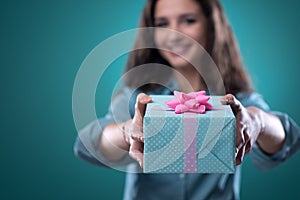 Girl giving a beautiful gift photo