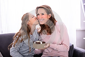 Girl Giving Gift To Her Mother