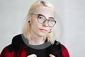 Girl in glasses. in a checkered