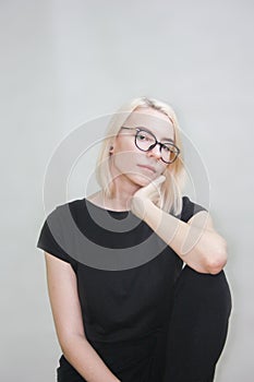 Girl in glasses. portrait on white