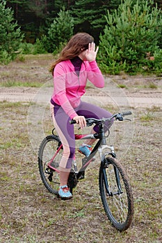 The girl goes on a bicycle