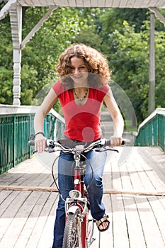 Girl goes by bicycle