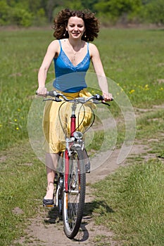 Girl goes by bicycle