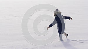 Girl going through deep snow