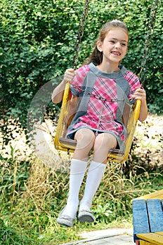 Girl going for drive on merry-go-round