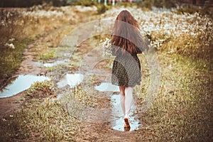 Girl going on rural road