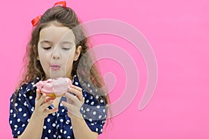 Girl going to eat a sweet donut.