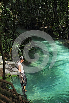 Girl going to swim in Kali biru Warsambin - Blue River