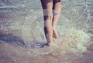 A girl going to swim in the ocean