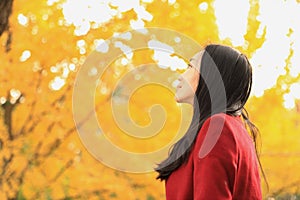 Girl in Golden autumn garden