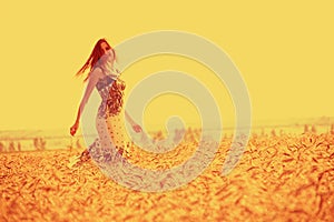 Girl in golden cornfield