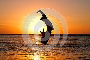 Girl at golden sunset at beach