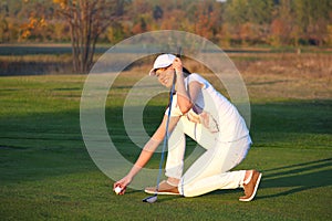 Girl golf player on field