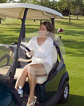 Girl Golfer In Cart