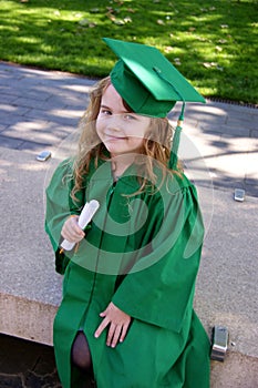 Girl in gown, graduating from kindergarten